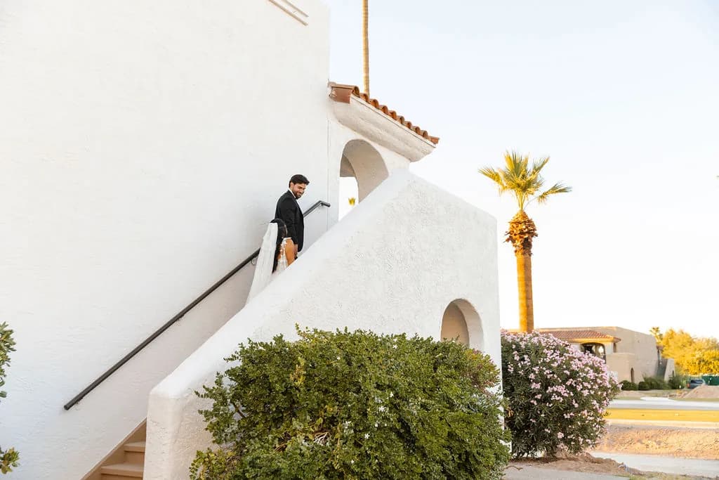 White Spanish-style architecture and desert landscaping at Kimpton Miralina Resort