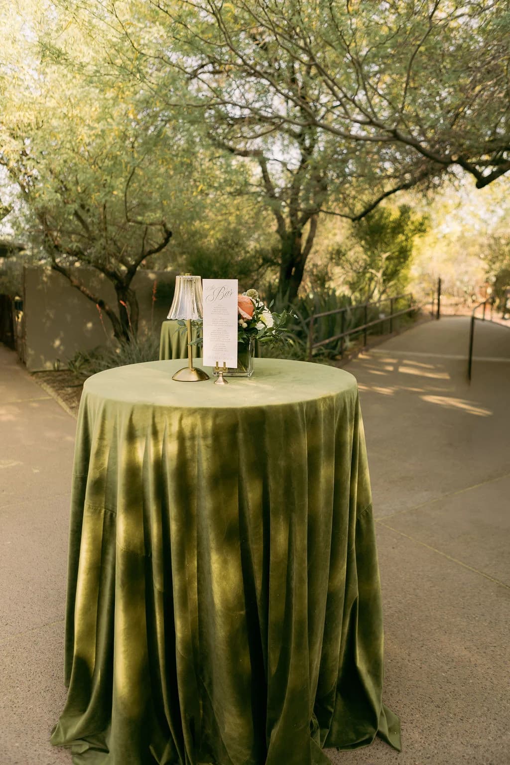 Green velvet cocktail table at a Desert Botanical Garden wedding reception
