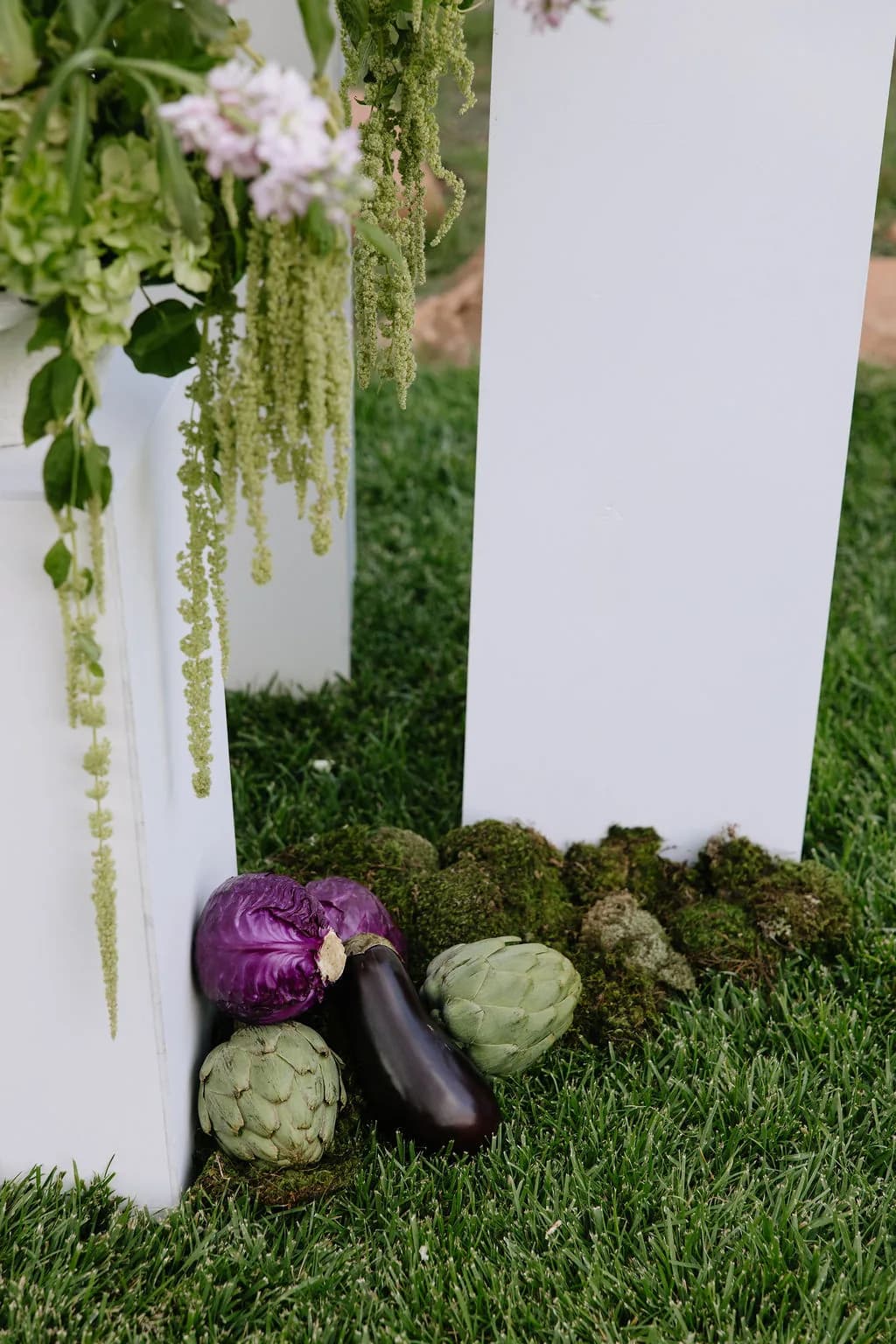 Ceremony floral pillars with cascading greenery at Enchantment Resort