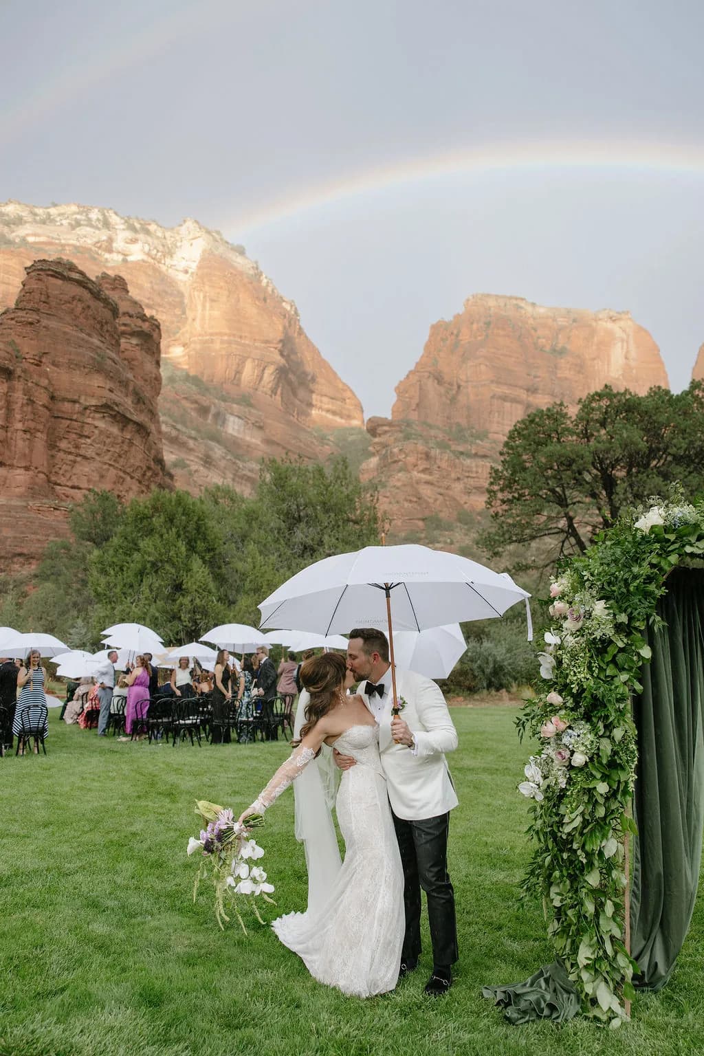Rainbow over the red rocks during a wedding at Enchantment Resort