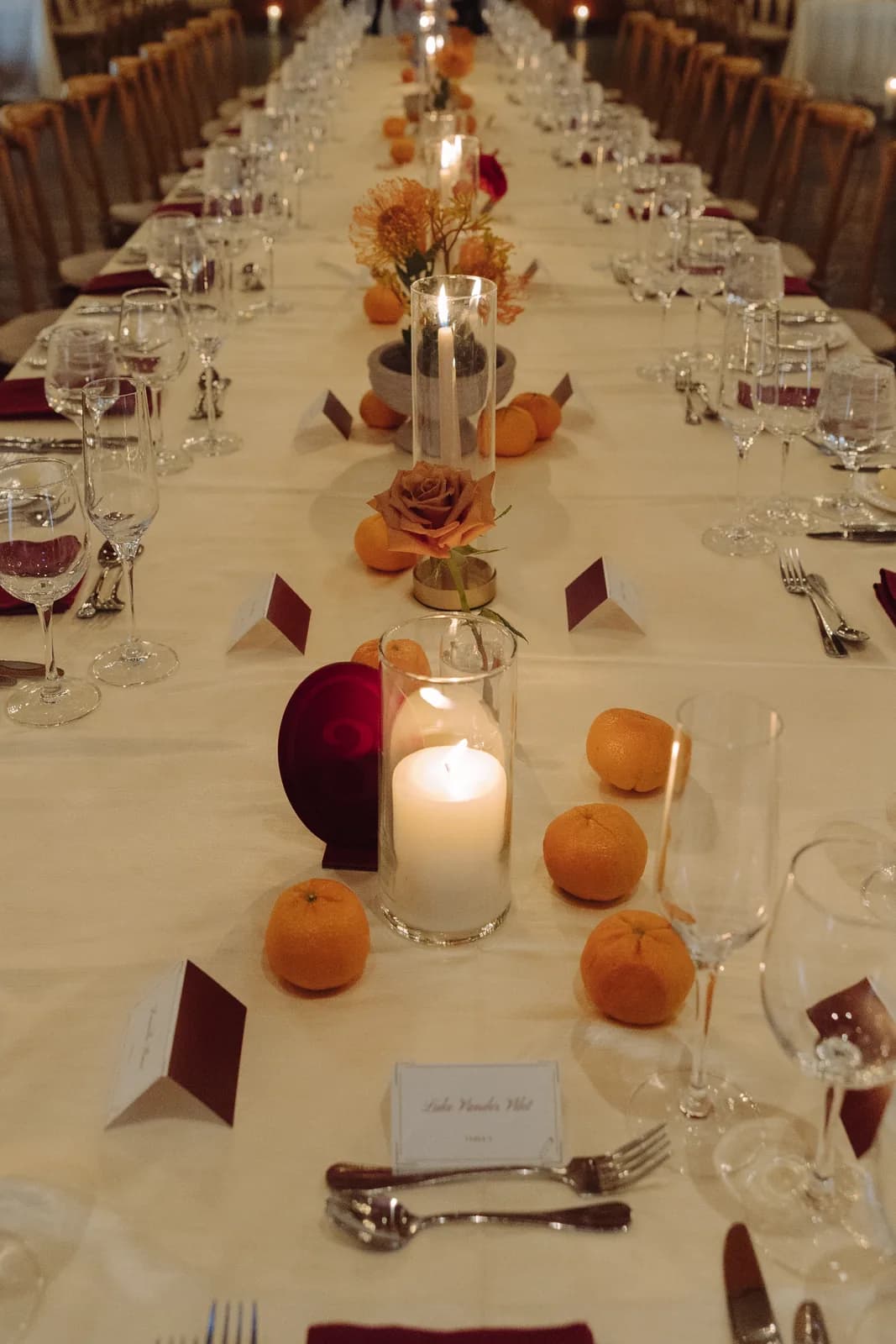 Candlelit reception table with citrus accents at Omni Montelucia