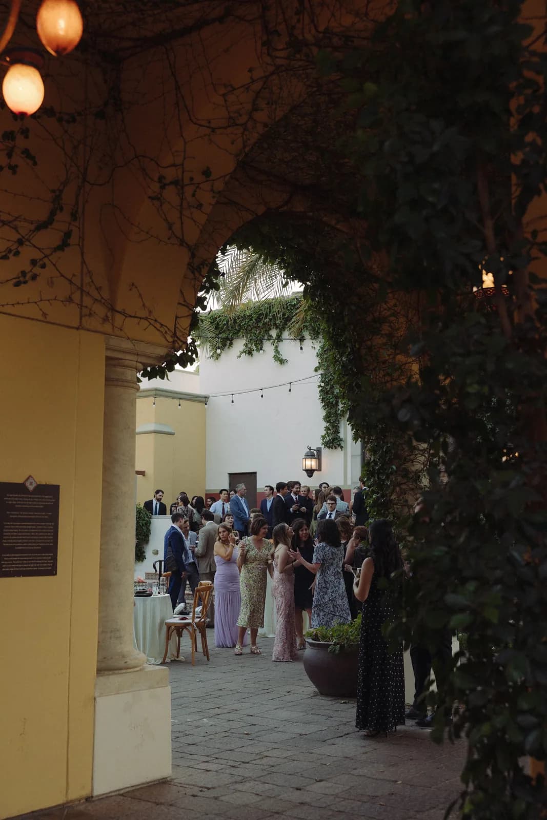 Ivy-covered archway into the courtyard reception at Omni Montelucia
