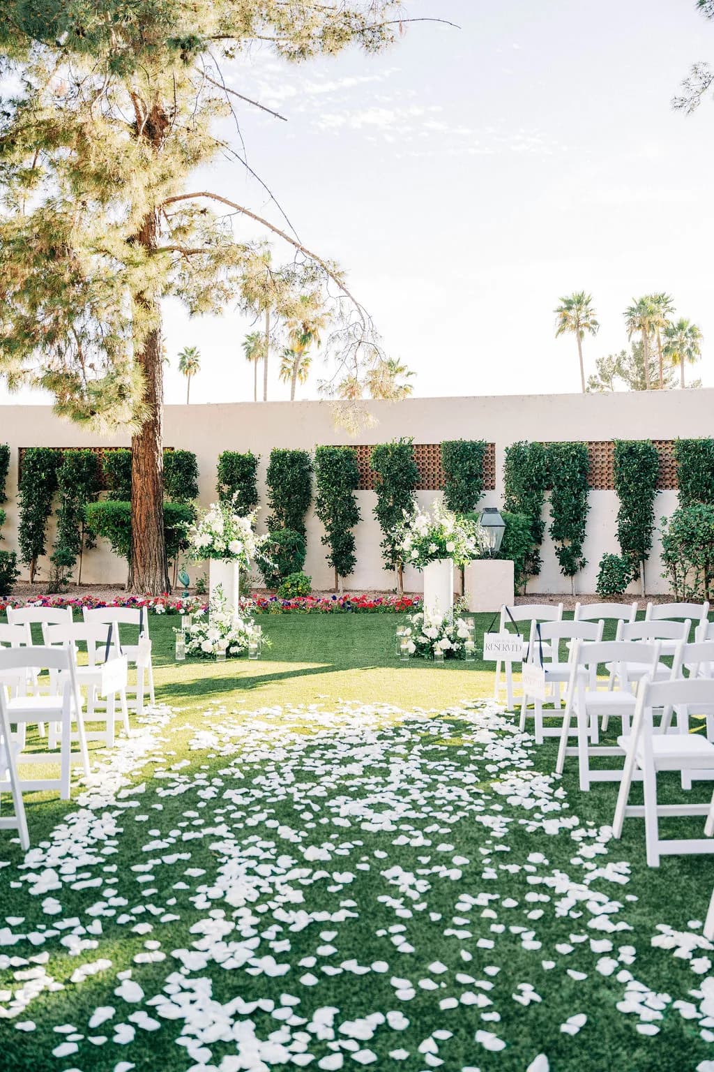 Petal-lined courtyard ceremony aisle at The Scottsdale Resort & Spa, Curio Collection