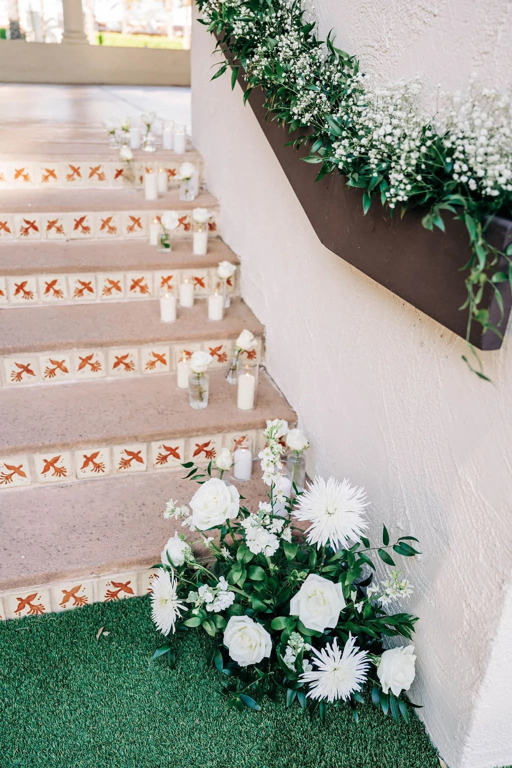 Tiled staircase decorated with candles and florals at The Scottsdale Resort